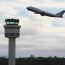 505px-Melbourne_airport_control_tower_and_united_B747.jpg